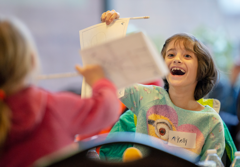 drawing-190220-165 2 girls showing their drawings at Walt Disney Day Feb. 2019